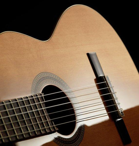 How to change strings on a classical guitar ?